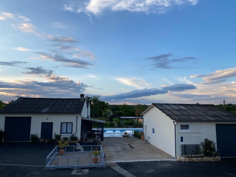 Courtyard, outbuildings and off-street parking under a wide Charente sky