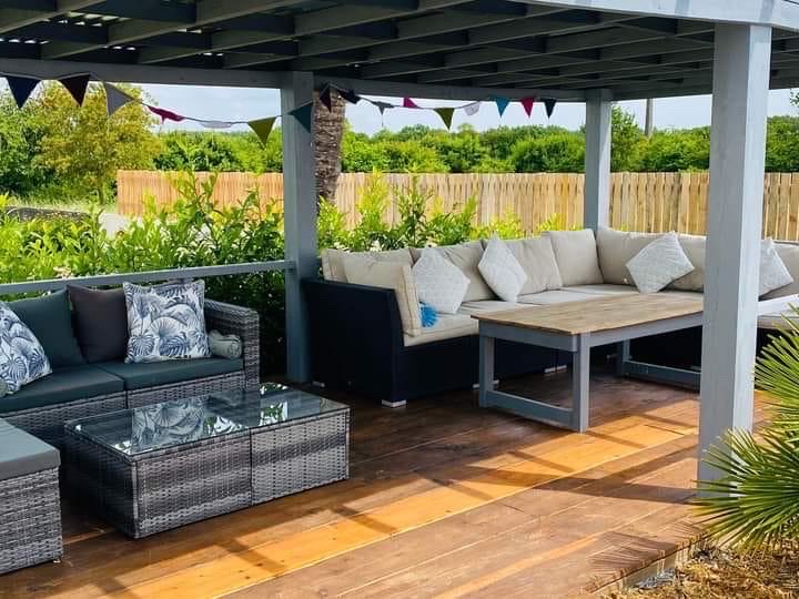 Relaxed pergola seating beside the swimming pool